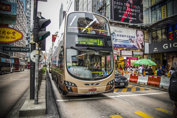 Hongkong Street billboard colourful double-decker bus business district