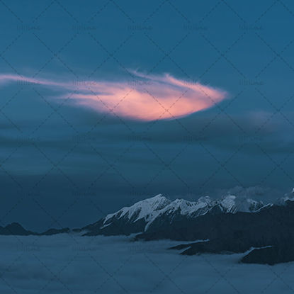 Burning clouds on snow mountain