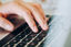 Hand Finger On The Computer Keyboard