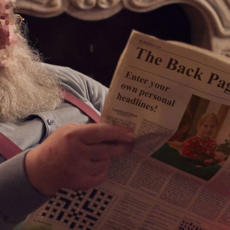 Santa reading newspaper