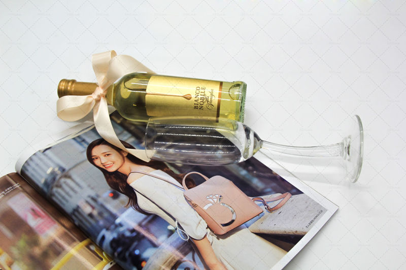 Golden champagne,gift,ribbon,champagne glass,magazine